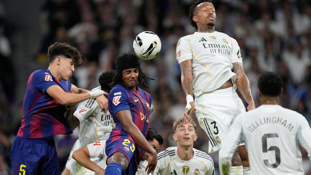 020851700_1761536841-Barcelona_s_Jules_Kounde_heads_the_ball_during_a_La_Liga_soccer_match_between_Real_Madrid_and_Barcelona
